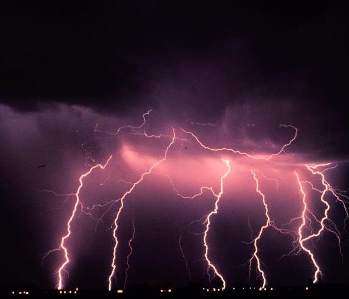 Image of a thunderstorm, multiple lightening strikes 